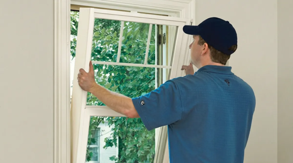 Professional contractors performing a residential window insulation and replacement service in Hialeah, FL